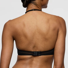 Load image into Gallery viewer, Black bikini top worn by a person on a plain background