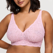 Load image into Gallery viewer, Woman wearing a pink lace bralette against a plain background