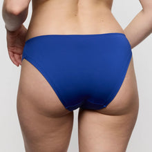 Load image into Gallery viewer, Blue underwear worn by a person on a plain background