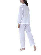 Load image into Gallery viewer, Classic 100% Swiss cotton Pyjamas. Revere collar on loose jacket. There is pocket on the hip and a feminine lace trim on the cuff hem. Full length trousers with a gentle elasticated waist. Made in Germany from the finest pure Swiss cotton, Celestine nightwear is diaphanous, offering perfect sleep without heaviness. Fabric composition: 100% Pure Swiss Cotton. 100% Guipure Cotton Lace. Machine Washable.