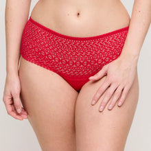 Load image into Gallery viewer, Red patterned underwear worn by a person on a plain background