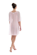 Load image into Gallery viewer, Azure Short (98cm) 3/4 Length Sleeve nightgown. Gorgeous 100% Guipure Cotton Lace at the gently rounded neckline and sleeve edge. Flared skirt for ease of movement when sleeping. Made in Germany from the finest pure cotton mousseline, Celestine nightdresses are diaphanous, offering perfect sleep without heaviness.
Celestine nightwear, dressing gowns and short robes drop from the shoulder, therefore one size fits all.
Composition: 100% Pure Swiss Cotton, 100% Guipure Cotton Lace
Machine Washable.
