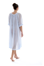 Load image into Gallery viewer, Azure Full length (123cm) 3/4 length sleeve nightgown. Gorgeous 100% Guipure Cotton Lace at the gently rounded neckline and a frilled detail at the sleeve hem. Flared skirt for ease of movement when sleeping. Made in Germany from the finest pure cotton mousseline, Celestine nightdresses are diaphanous, offering perfect sleep without heaviness.
Celestine nightwear, dressing gowns and short robes drop from the shoulder, therefore one size fits all.
100% Pure Swiss Cotton, 100% Guipure Cotton Lace.