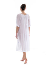 Load image into Gallery viewer, White Full length (123cm) 3/4 length sleeve nightgown. Gorgeous 100% Guipure Cotton Lace at the gently rounded neckline and a frilled detail at the sleeve hem. Flared skirt for ease of movement when sleeping. Made in Germany from the finest pure cotton mousseline, Celestine nightdresses are diaphanous, offering perfect sleep without heaviness.
Celestine nightwear, dressing gowns and short robes drop from the shoulder, therefore one size fits all.
100% Pure Swiss Cotton, 100% Guipure Cotton Lace.
