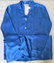 Load image into Gallery viewer, Ultramarine Blue. Classic pure silk 'men's style' pyjamas. They are made from19mm 100% pure heavy weight Silk Satin. One seam on the leg for extra comfort. Mother-of-pearl buttons, elastic waist on the back of the trouser with a drawstring waist to the front. French seams throughout for that added comfort. Made in Florence,
Composition: Pure Silk Satin
Made in Italy
Machine washable.