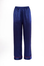 Load image into Gallery viewer, Our own classic pure silk 'men's style' pyjamas. They are made from 19 mm 100% pure heavyweight Silk Satin. One seam on the leg for extra comfort. Mother-of-pearl buttons, elastic waist the trousers. Perfect for sleeping and loungewear. Available in two colourways: Navy/Crimson Piping.