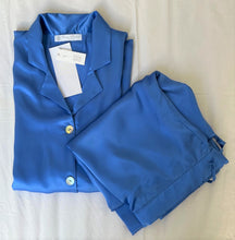 Load image into Gallery viewer, Ultramarine Blue. Classic pure silk 'men's style' pyjamas. They are made from19mm 100% pure heavy weight Silk Satin. One seam on the leg for extra comfort. Mother-of-pearl buttons, elastic waist on the back of the trouser with a drawstring waist to the front. French seams throughout for that added comfort. Made in Florence,
Composition: Pure Silk Satin
Made in Italy
Machine washable.