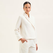 Load image into Gallery viewer, Soft fleece wrap-over long-sleeved Laurence Tavernier bedjacket.
It closes with a single Corozo button. The shawl collar and curved front detail add the final touches of style to this soft, light and cosy bedjacket.