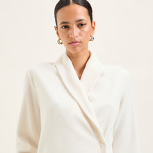 Load image into Gallery viewer, Soft fleece wrap-over long-sleeved Laurence Tavernier bedjacket.
It closes with a single Corozo button. The shawl collar and curved front detail add the final touches of style to this soft, light and cosy bedjacket.