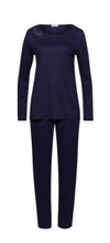 Load image into Gallery viewer, Evening Blue. Made from 100% soft mercerised knitted cotton, Rounded neckline with an appliqué asymmetric lace inset at the neckline. Long sleeves and with slender fitting trousers, elasticated at the waist. Perfect item for lounging or sound sleep.
Composition:
100% Pure Cotton
100% Polyester Lace
Made in Europe
Machine washable