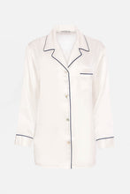 Load image into Gallery viewer, Our own classic pure silk 'men's style' pyjamas. They are made from 19 mm 100% pure heavyweight Silk Satin. One seam on the leg for extra comfort. Mother-of-pearl buttons, elastic waist the trousers. Perfect for sleeping and loungewear. Available in two colourways: Ivory/Navy Piping.