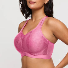 Load image into Gallery viewer, Pink sports bra worn by a model on a light gray background
