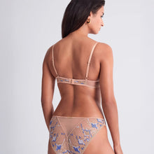 Load image into Gallery viewer, Back view of a person with long brown hair wearing a beige bra and panties with blue geometric French embroidery. The background is a plain light gray.