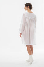 Load image into Gallery viewer, Lovely short (98cm) long sleeve short nightgown. Lace details on the rounded neck, hem and cuffs. Flared skirt for ease of movement when sleeping. Made in Germany from the finest pure cotton mousseline, Celestine nightdresses are diaphanous, offering perfect sleep without heaviness. Celestine nightwear, dressing gowns and short robes drop from the shoulder, therefore one size fits all.  Composition: 100% Pure Swiss Cotton 100% Cotton Lace Machine Washable
