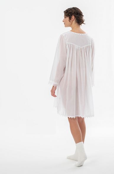 Lovely short (98cm) long sleeve short nightgown. Lace details on the rounded neck, hem and cuffs. Flared skirt for ease of movement when sleeping. Made in Germany from the finest pure cotton mousseline, Celestine nightdresses are diaphanous, offering perfect sleep without heaviness. Celestine nightwear, dressing gowns and short robes drop from the shoulder, therefore one size fits all.  Composition: 100% Pure Swiss Cotton 100% Cotton Lace Machine Washable