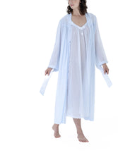 Load image into Gallery viewer, Azure. Full length (130cm), frilled collar robe. Made in Germany from the finest mousseline, this full length, diaphanous dressing gown is a 100% pure cotton. It offers the wearer perfect cover without heaviness. Celestine garments are addictive, so watch out. Once tried, there is no turning back! Celestine nightwear, dressing gowns and short robes drop from the shoulder, therefore one size fits all. Composition: 100% Pure Swiss Cotton Machine