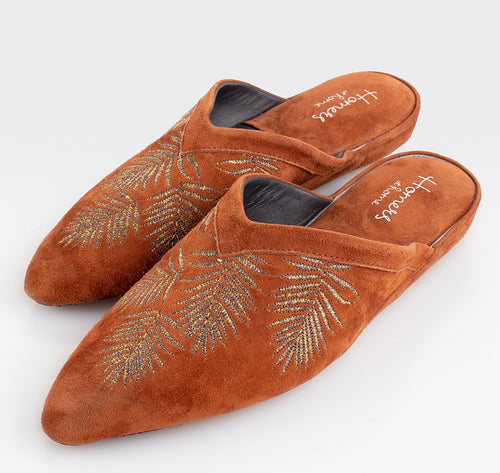 Stylish Moroccan style suede slippers. All suede upper with padded insole for extra comfort. Rubber sole for non-slip wear. Perfect for home or outerwear.  Rust Gold.