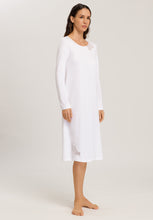 Load image into Gallery viewer, Made from 100% soft mercerised knitted cotton. This is a lovely 3/4 length long sleeve nightgown. Rounded neckline with an appliqué lace inset at the neck & front hem. Perfect item for lounging or sound sleep. Deliciously comfortable for sleeping and lounging. Length: 110cm Composition: 100% Pure Cotton 100% Polyester Lace Made in Europe Machine washable. Soft White.