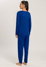 Load image into Gallery viewer, Made from 100% soft mercerised knitted cotton, Rounded neckline with an appliqué lace inset at the neck & front hem. Perfect item for lounging or sound sleep. Gentle rounded collar, long sleeves and with loose fitting trousers, elasticated at the waist. Composition: 100% Pure Cotton 100% Polyester Lace Made in Europe Machine washable. Indigo Blue.