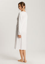 Load image into Gallery viewer, Soft White Attractive 100% soft mercerised knitted cotton. This is a Long Sleeve 3/4 length nightgown with a gentle round neckline. It has a lace inset on the neckline mirrored by a deep lace inset on the opposite hem. Light and airy to wear in bed. Deliciously comfortable for sleeping and lounging.
Length: 110cm
Composition: 100% Pure Cotton, 100% Polyester Lace.
Made in Europe
Machine washable