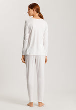 Load image into Gallery viewer, Soft White. Made from 100% soft mercerised knitted cotton, Rounded neckline with an appliqué asymmetric lace inset at the neckline. Long sleeves and with slender fitting trousers, elasticated at the waist. Perfect item for lounging or sound sleep.
Composition:
100% Pure Cotton
100% Polyester Lace
Made in Europe
Machine washable