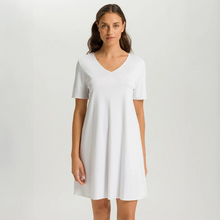 Load image into Gallery viewer, Embrace modern comfort with Hanro Cotton Silk Short-Sleeved Nightdress. This piece features a soft, mercerised cotton interlock construction, enhanced by subtle silk details. The short sleeves and ideal length of 90cm makes it perfect for a stylish and comfortable night's rest or relaxed lounging.