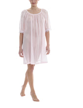 Load image into Gallery viewer, Rose Short (98cm) 3/4 Length Sleeve nightgown. Gorgeous 100% Guipure Cotton Lace at the gently rounded neckline and sleeve edge. Flared skirt for ease of movement when sleeping. Made in Germany from the finest pure cotton mousseline, Celestine nightdresses are diaphanous, offering perfect sleep without heaviness.
Celestine nightwear, dressing gowns and short robes drop from the shoulder, therefore one size fits all.
Composition: 100% Pure Swiss Cotton, 100% Guipure Cotton Lace
Machine Washable.