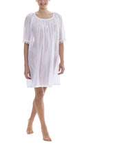 Load image into Gallery viewer, White Short (98cm) 3/4 Length Sleeve nightgown. Gorgeous 100% Guipure Cotton Lace at the gently rounded neckline and sleeve edge. Flared skirt for ease of movement when sleeping. Made in Germany from the finest pure cotton mousseline, Celestine nightdresses are diaphanous, offering perfect sleep without heaviness.
Celestine nightwear, dressing gowns and short robes drop from the shoulder, therefore one size fits all.
Composition: 100% Pure Swiss Cotton, 100% Guipure Cotton Lace
Machine Washable.