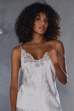 Load image into Gallery viewer, Ivory set.
This Marjolaine camisole and French knicker set is generously embellished with appliqué Calais lace. Camisole has spaghetti adjustable straps and the appliqué lace forms a sumptuous detail on the front, continuing down the front of the garment. The French Knickers have a sumptuous detail of appliqué lace on both hips. Its tone-on-tone Calais lace makes it a piece rich in luxurious details, while maintaining an airy yet comfy cut.