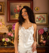Load image into Gallery viewer, Ivory. Pure Silk Camisole & Frenck Knicker Set. They are generously embellished with appliqué Calais lace. The Camisole has rouleau adjustable straps. The appliqué lace forms a sumptuous detail on the front, continuing down the sides of the garment. The French Knickers have a sumptuous derail of appliqué lace on both hips. Ink/Ivory Smoke/Black Ivory/Ivory Composition: 100% Silk Satin Calais Lace 75% Cotton, 25% Nylon Machine washable