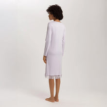 Load image into Gallery viewer, Image of the back of a woman wearing a Pink Lavender long sleeve knee length nightdress with an embroidered tulle hem. The garment has a lovely feminine flow to it.