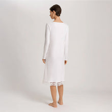 Load image into Gallery viewer, Image of the back of a woman wearing an Off White long sleeve knee length nightdress with an embroidered tulle hem. The garment has a lovely feminine flow to it.