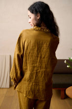 Load image into Gallery viewer, SALE 100% Pure Linen Pyjamas made by Luuna Mine; an artisan design studio based in Shanghai. The jacket has a shirt tail at the back, a gathered frilled cuff on the sleeve and signature moon embroidery detail on the classic collar. The trousers have two side pockets, a wide leg and an elasticated waist & French seams throughout. Perfect for sleeping and loungewear. Composition: 100% Linen. Machine washable. Sizing advice: These pyjamas come up small. If in doubt, select the bigger size.