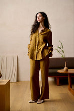 Load image into Gallery viewer, SALE 100% Pure Linen Pyjamas made by Luuna Mine; an artisan design studio based in Shanghai. The jacket has a shirt tail at the back, a gathered frilled cuff on the sleeve and signature moon embroidery detail on the classic collar. The trousers have two side pockets, a wide leg and an elasticated waist & French seams throughout. Perfect for sleeping and loungewear. Composition: 100% Linen. Machine washable. Sizing advice: These pyjamas come up small. If in doubt, select the bigger size.
