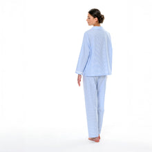 Load image into Gallery viewer, Blue & white stripe pure cotton pyjamas trimmed with 100% cotton lace. Front buttoned with a revere collar. Full length trouser with a soft elasticated waist. Perfect for sleeping or lounging.
Celestine garments are also addictive, so watch out. Once tried, there is no turning back! Celestine nightwear, dressing gowns, short robes and pyjamas drop from the shoulder, therefore one size fits all.
Fabric composition: 100% Cotton.
Made in Germany.
Machine Washable.