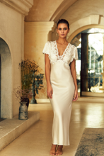 Load image into Gallery viewer, Made in France, a beautiful full length nightgown. It has a lovely lace festooned V neck and all lace short sleeves. Beautifully scooped back with lacing details. Its 92% and 8% spandex silk satin will delicately envelop the curves of the body giving a sensuous look and feel. Composition: Silk Satin 92%, 8% Spandex Care instructions: Machine or Hand wash in cold water. Length: 150cm approximately.