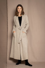 Load image into Gallery viewer, Biscuit 100% Cashmere Dressing Gown is the perfect piece of nightwear or loungewear. Made in Ireland in a 2x2 rib knit 2 ply 100% cashmere. The ribbed texture gives this beautiful garment a modern contemporary look with all the comfort and of pure cashmere.
Kimono style robe, it has two patch pockets to the from, and double loops at the sides for the perfect placement of the belt.