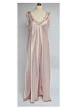 Load image into Gallery viewer, Gorgeous V neck full length nightgown in a heavy weight pure silk satin. This nightgown has wide straps for pure comfort when sleeping. It will not slip from the shoulders and will stay in place. The back is nicely high for warmth and style. There is a silk chiffon ruffle around the neck and shoulders for softness and femininity. The nightgown is cut on the bias, with a side slit, for full movement. Fabric Content: 100% Pure Silk Made in Italy