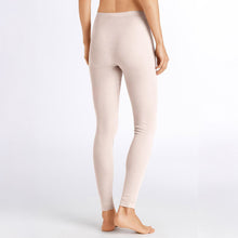 Load image into Gallery viewer, Image of the back of a woman wearing the vanilla silk cashmere leggings. Showing that there is no seam going up the back of the bum.