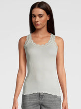Load image into Gallery viewer, Ivory. Singlet style delicate fine ribbed knit fabric in pure silk organza with the most elegant and feminine French leavers lace and the neckline and shoulder. The lace is certified and numbered as true “Dentelle de Calais®”. Super-soft touch with no side seams, the construction is for the ultimate in comfort. Featuring a gently scooped neckline this singlet allows for a multiple of uses, as underwear or outerwear. 100% Silk All Oscalito Sik is certified GOTs. Machine washable