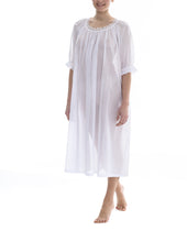 Load image into Gallery viewer, White Full length (123cm) 3/4 length sleeve nightgown. Gorgeous 100% Guipure Cotton Lace at the gently rounded neckline and a frilled detail at the sleeve hem. Flared skirt for ease of movement when sleeping. Made in Germany from the finest pure cotton mousseline, Celestine nightdresses are diaphanous, offering perfect sleep without heaviness.
Celestine nightwear, dressing gowns and short robes drop from the shoulder, therefore one size fits all.
100% Pure Swiss Cotton, 100% Guipure Cotton Lace.