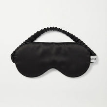 Load image into Gallery viewer, A black pure silk satin sleep mask with an elasticized strap, displayed flat against a clean white background.