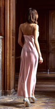 Load image into Gallery viewer, Rose/Granite. Made in France, a beautiful nightgown made from 100% silk satin. Full length with heavily appliquéd Calais lace detail on the bodice. The straps have an adjustment for creating the perfect fit. Luxurious, elegant nightwear.
Composition: 100% Silk Satin
Calais Lace 75% Cotton, 25% Nylon
Care instructions:
Machine or Hand wash in cold water.