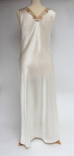 Load image into Gallery viewer, Magnificent wide shoulders, heavy silk full length nightgown. The beautiful lace bodice is fully lined for compete coverage. The wide straps allow for comfort when sleeping. The full length ivory bias cut skirt also has a slit for extra ease of movement. This is a top quality, classic style nightgown. Fabric Content: 100% Pure Silk Made in Italy