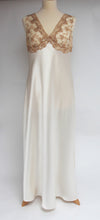 Load image into Gallery viewer, Magnificent wide shoulders, heavy silk full length nightgown. The beautiful lace bodice is fully lined for compete coverage. The wide straps allow for comfort when sleeping. The full length ivory bias cut skirt also has a slit for extra ease of movement. This is a top quality, classic style nightgown. Fabric Content: 100% Pure Silk Made in Italy