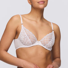 Load image into Gallery viewer, A woman wearing a white deep plunge bra with lace effect in the front.