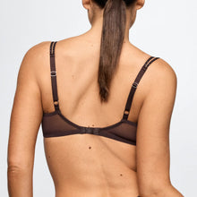 Load image into Gallery viewer, Person wearing a black bralette on a plain background