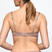 Load image into Gallery viewer, Woman wearing a beige bra with thin straps on a plain background