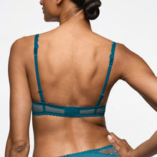 Load image into Gallery viewer, Teal lace bra worn by a model on a plain background