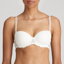 Load image into Gallery viewer, Jane formed and seamless cupped bra with the seductive balconnet neckline. Smooth opaque cups with floral lace trim. The wider wire ensures optimal comfort. Lifts the bust, creating a natural image. Perfect for multiple necklines. B to F cup. Fabric content: Polyamide: 66%, Polyester: 26%, Elastane: 8%. Ivory.